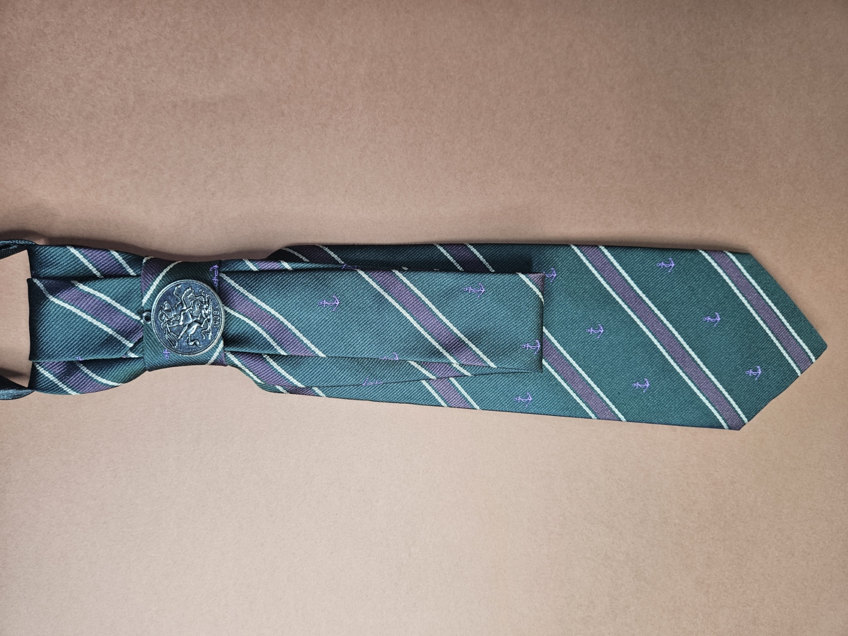 Green tie with purple stripes